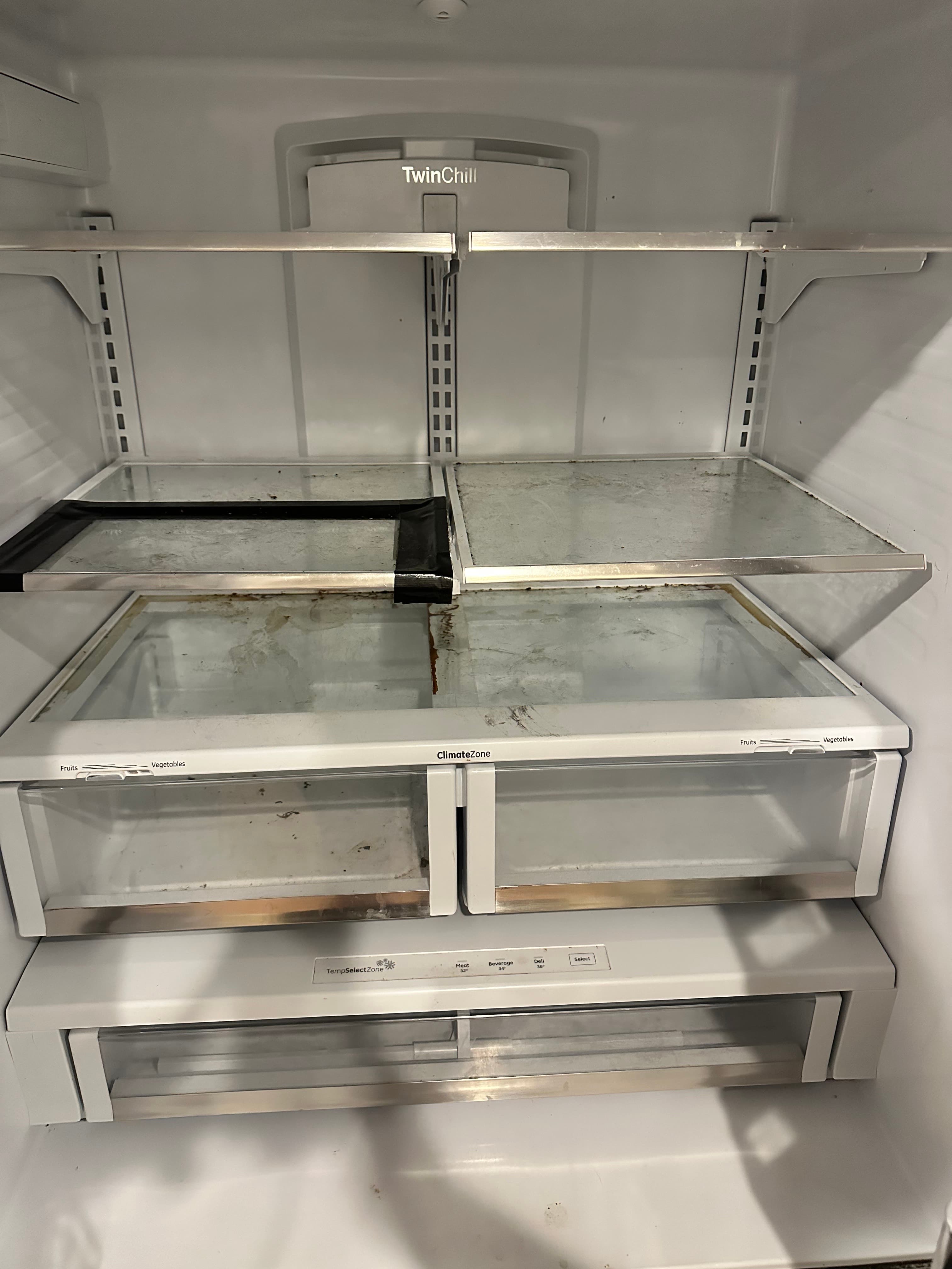 Deep cleaned fridge interior - Before